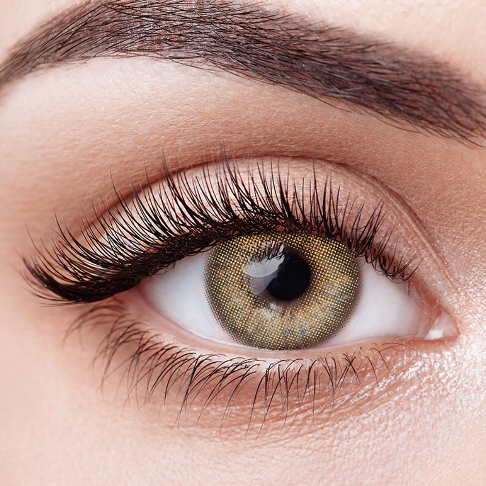 Aura Lens colored contact lenses in Radiance Brown – luminous, golden-brown lenses that brighten the eyes with a radiant, natural glow.